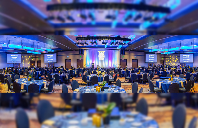 Lovely view of the 2023 Raising Hands event that shows the empty banquet room with the blue color and stars theme.  