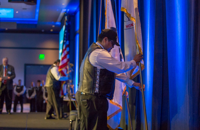 Tulalip Tribes’ 2018 Raising Hands photo of guest speaker introducing a ceremony with hands raised.